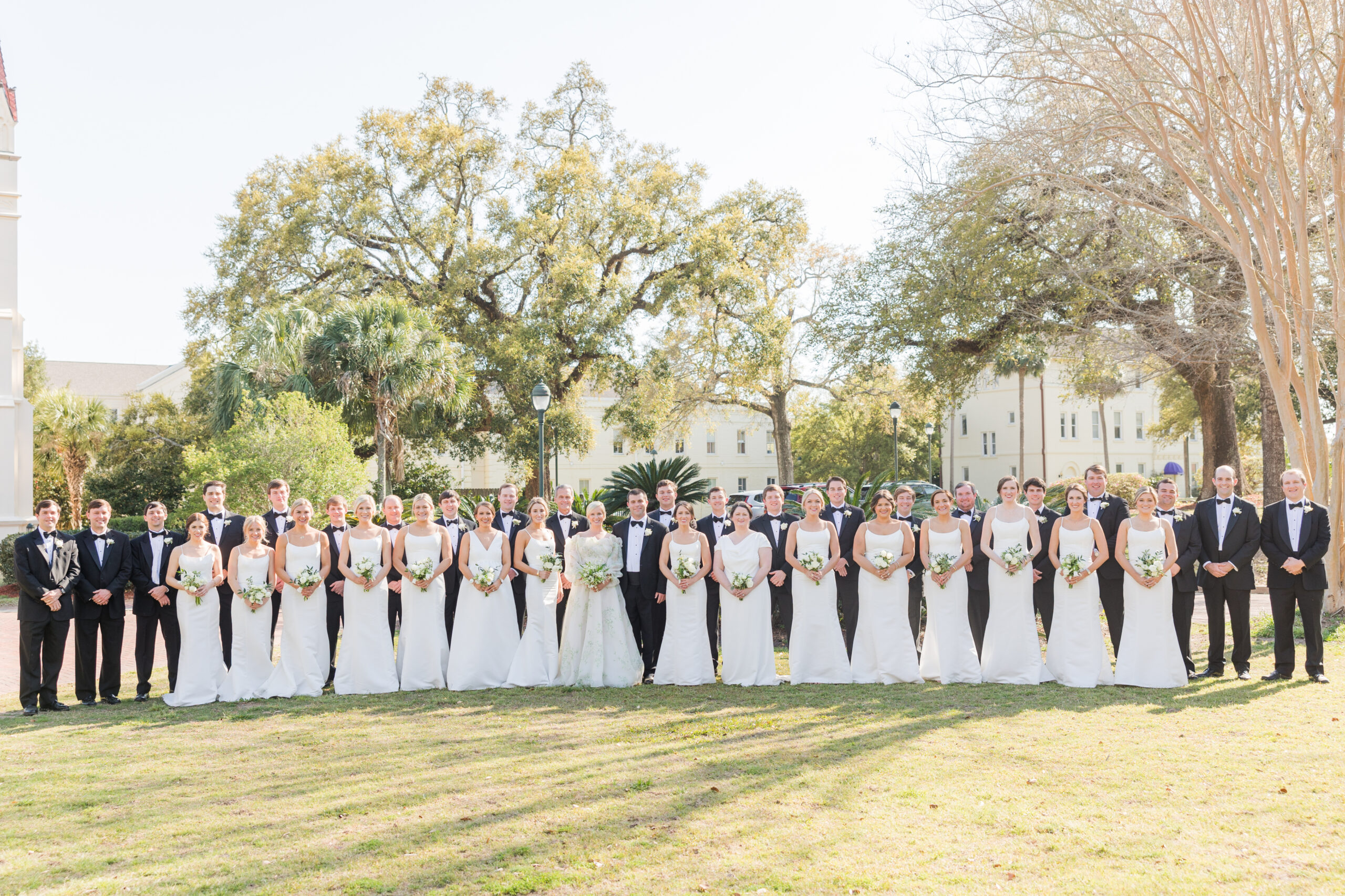 The wedding party poses together before the wedding ceremony in Mobile, Alabama.