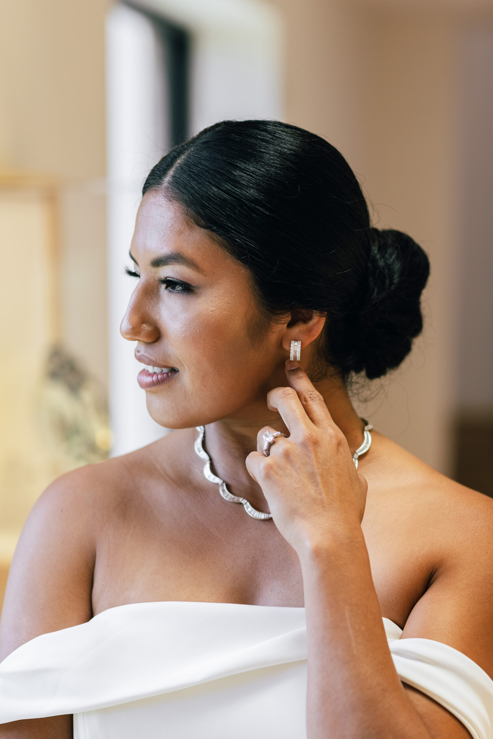 The bride wears jewelry from Bromberg's at this Southern wedding at Montgomery Museum of Fine Arts.