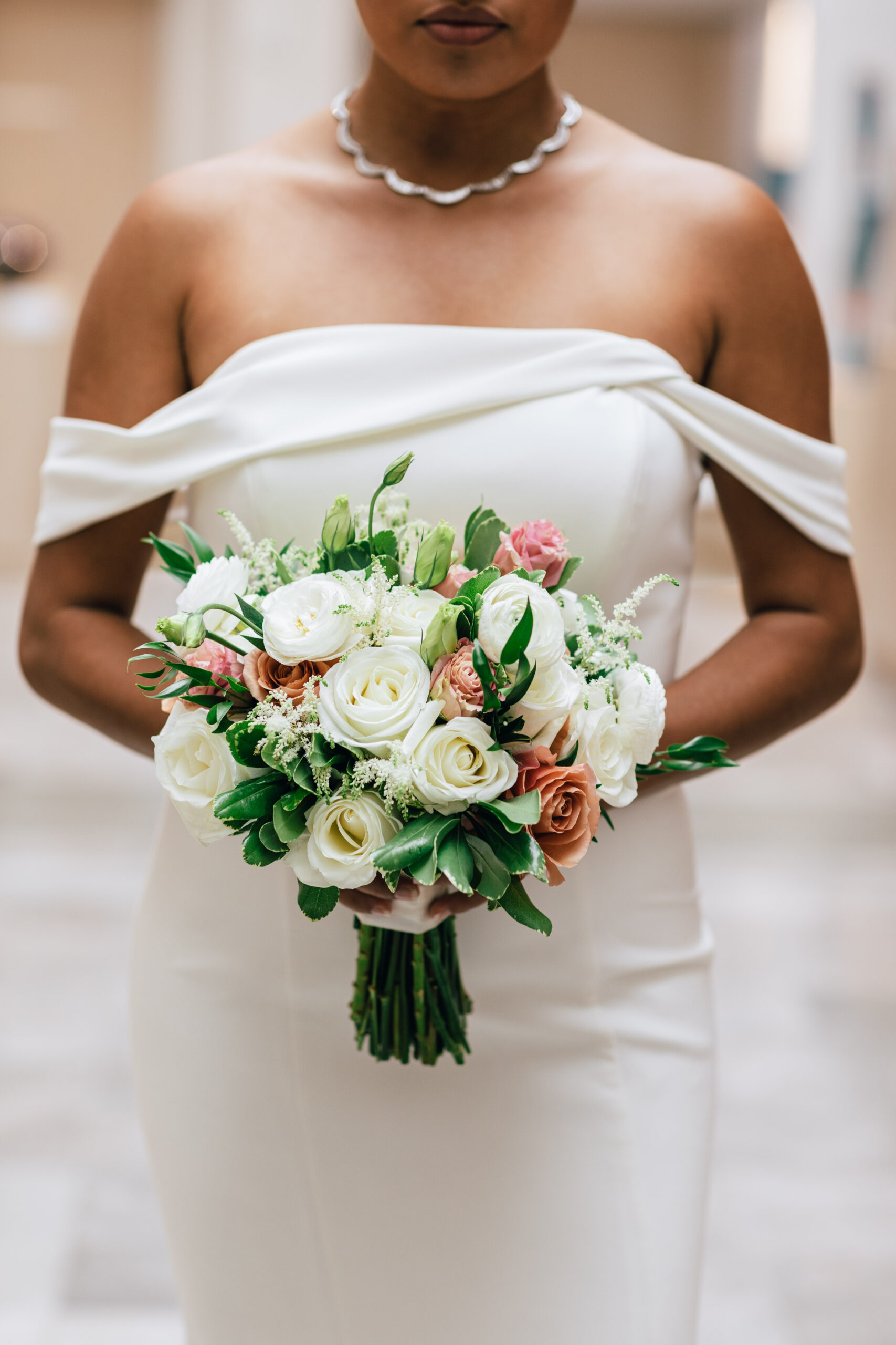 The bride holds her bouquet by Dana's Floral Design at Montgomery Museum of Fine Arts.