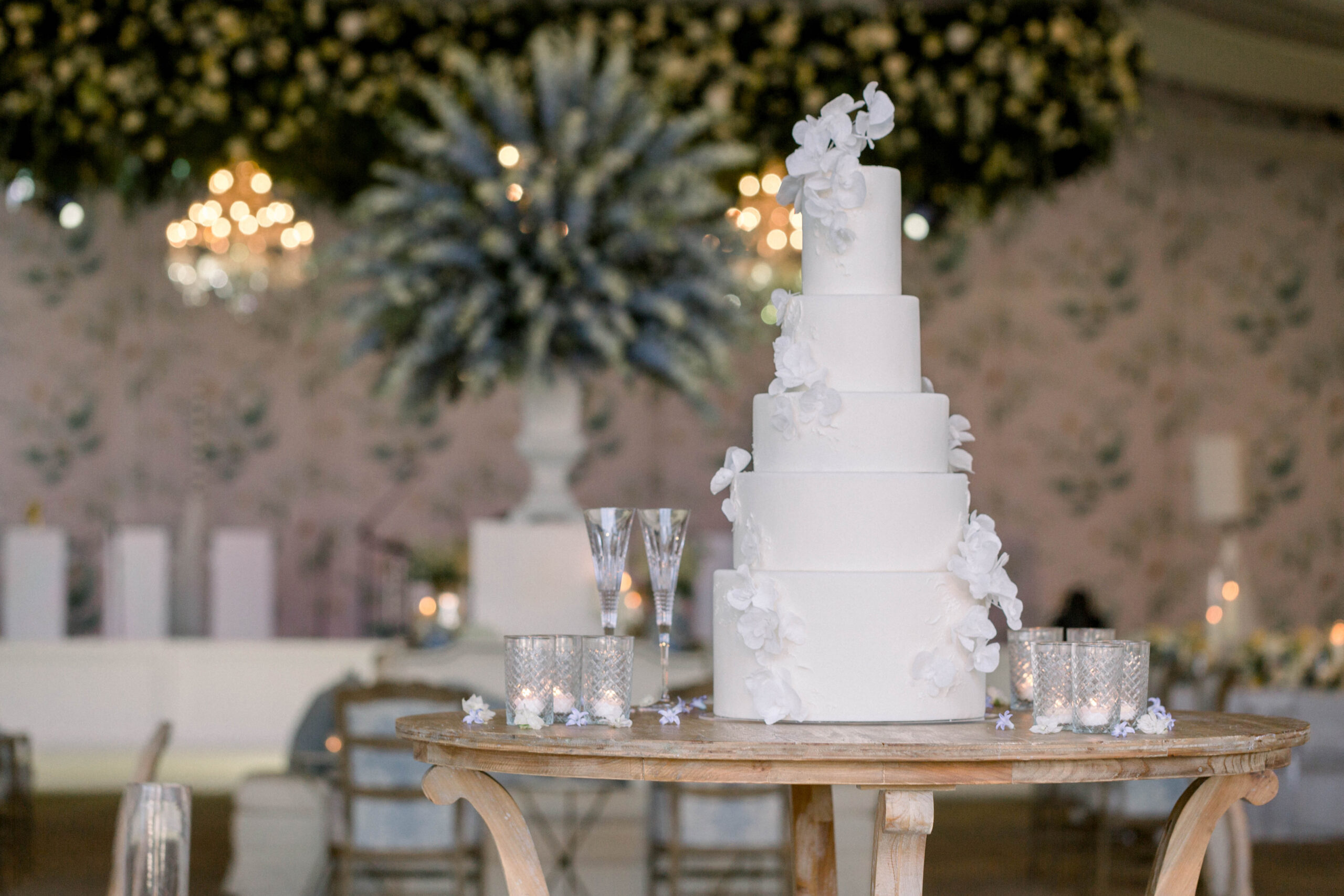 Sugar and Stems designed an all-white cake with sugar flowers for this Southern wedding at Pursell Farms.