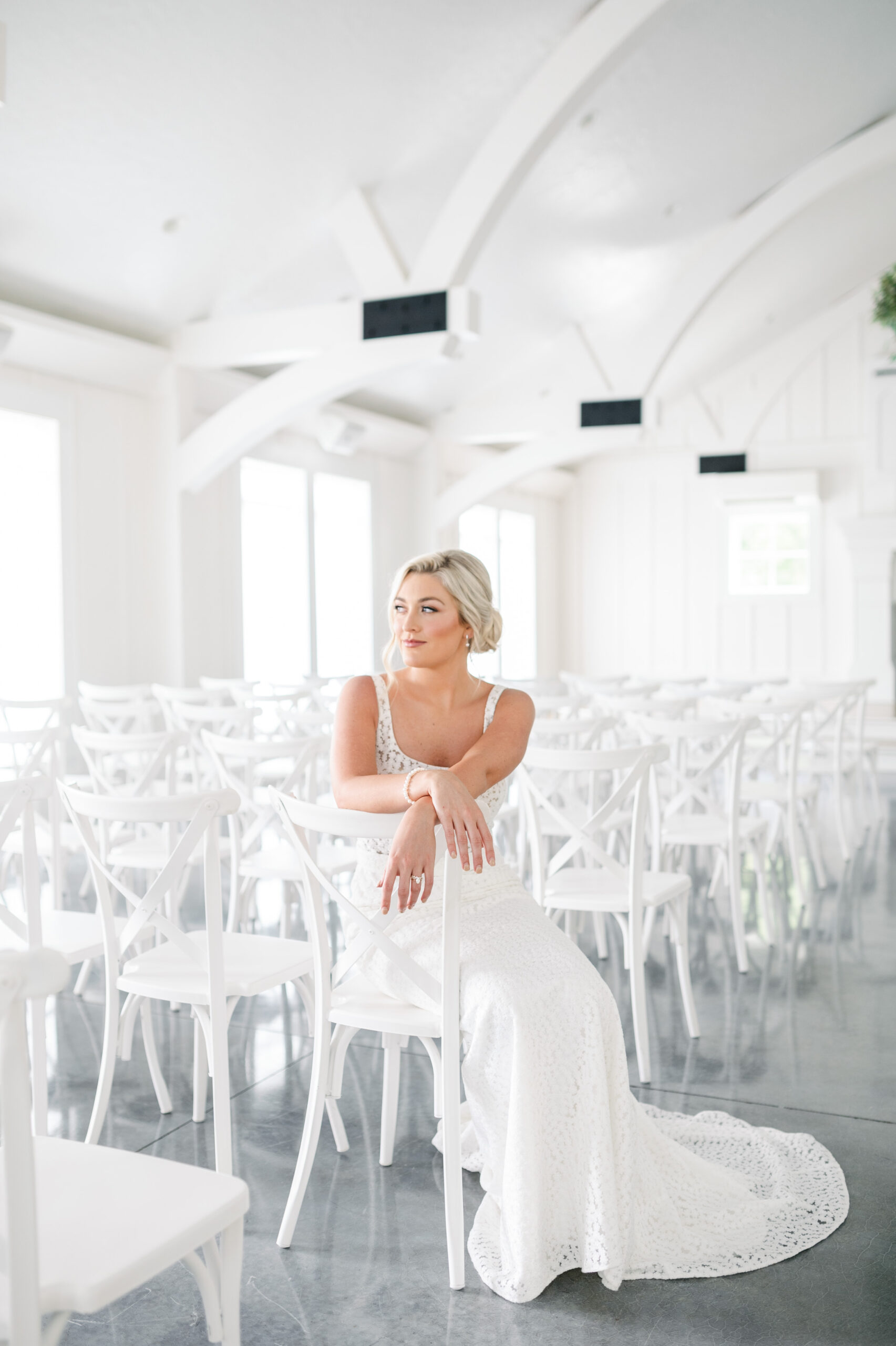 A Southern bride poses in her wedding dress from Bella's Bridal & Formal at Oak Meadow in Ohatchee, Alabama.