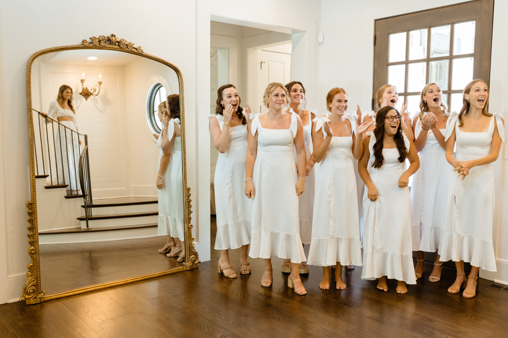 The bridal party sees the bride for the first time.