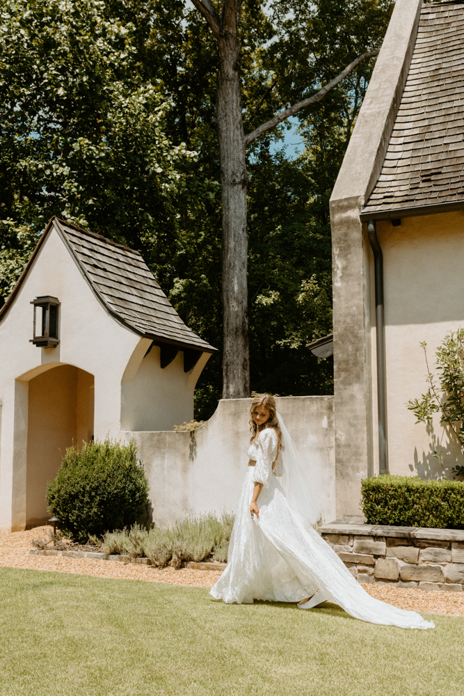 The bride walks outside in her Alabama wedding dress.