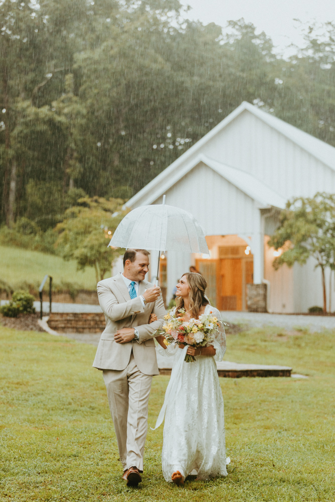 The father of the bride and the bride walk together to the Alabama wedding ceremony.