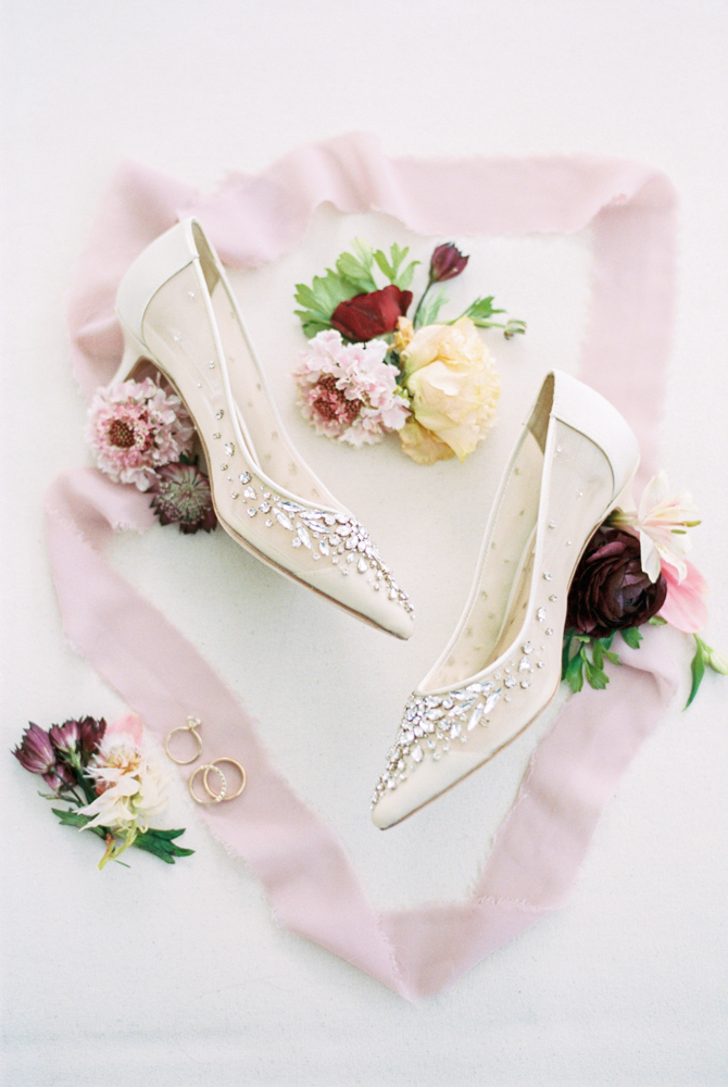 The bridal shoes are styled in a lay flat photograph by Piper Vine.