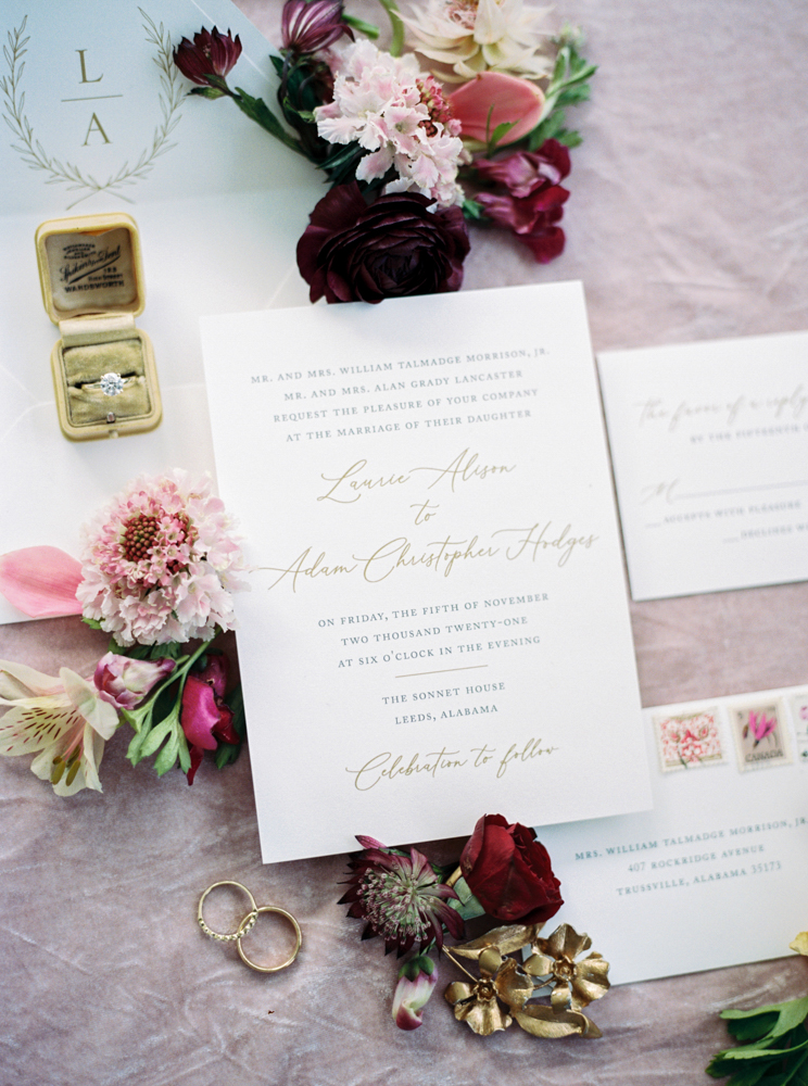 The wedding invitations for this fall wedding are photographed in a lay flat by Piper Vine.