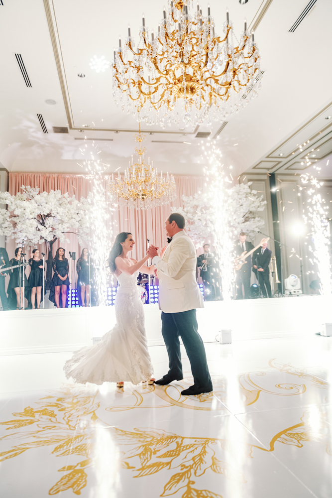 The bride and groom dance on a custom dance floor at Grand Bohemian Hotel Mountain Brook.