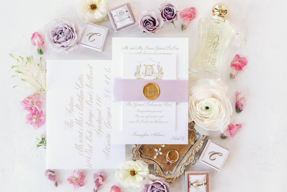 The Birmingham wedding invitations are photographed in a lay flat style with the accessories.