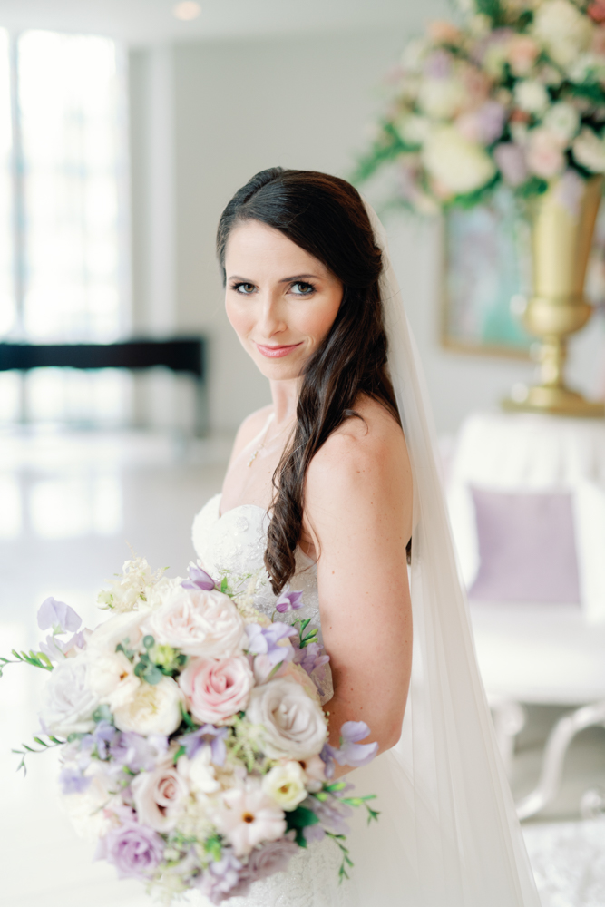 The bride holds her bouquet of spring flowers at Grand Bohemian Hotel Mountain Brook.