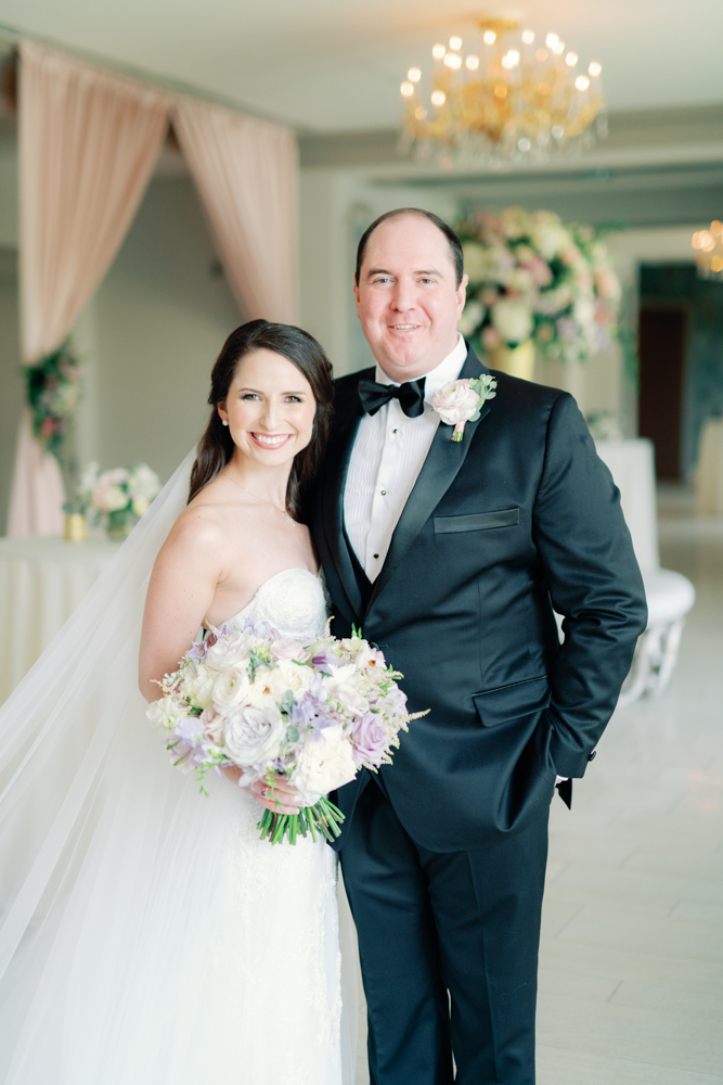 The bride and groom stand together at Grand Bohemian Hotel Mountain Brook.