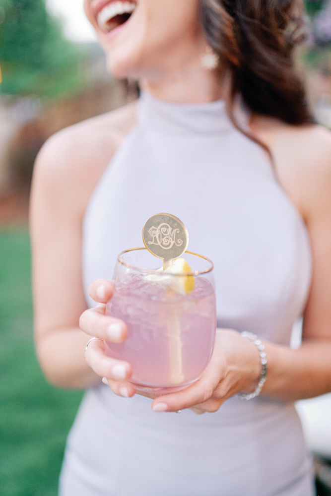 A wedding guests holds a cocktail at Grand Bohemian Hotel Mountain Brook.