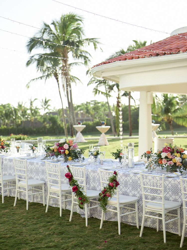 The destination wedding table scape features vibrant colors and patterns.