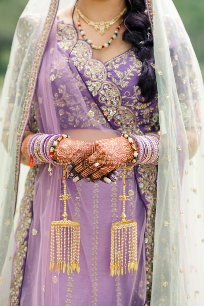 The bride shows her traditional Indian henna artistry before her wedding ceremony at Mathews Manor in Springville, Alabama.