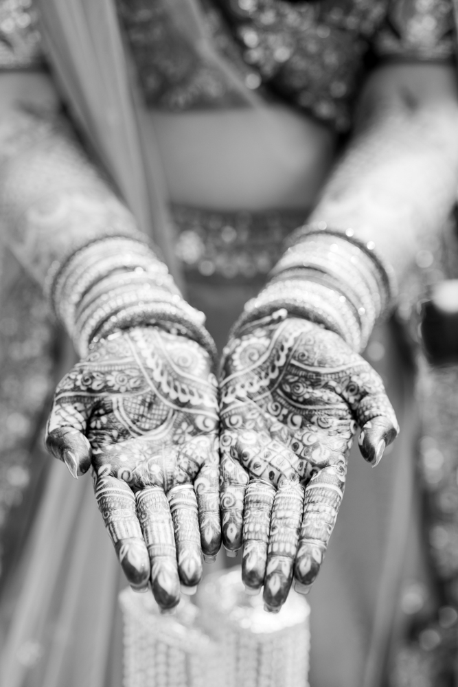 The bride shows her traditional Indian henna artistry before her wedding ceremony at Mathews Manor in Springville, Alabama.