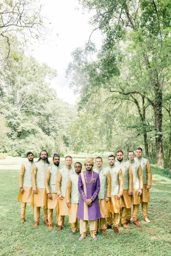 The groom stands with his groomsmen in traditional Indian wedding attire for the ceremony at Mathews Manor in Springville, Alabama.