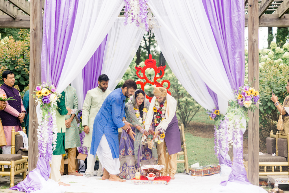 The bride and groom celebrate a traditional Indian wedding in Alabama at Mathews Manor.