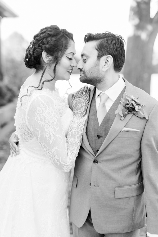 The bride and groom embrace for their Southern wedding at Mathews Manor.