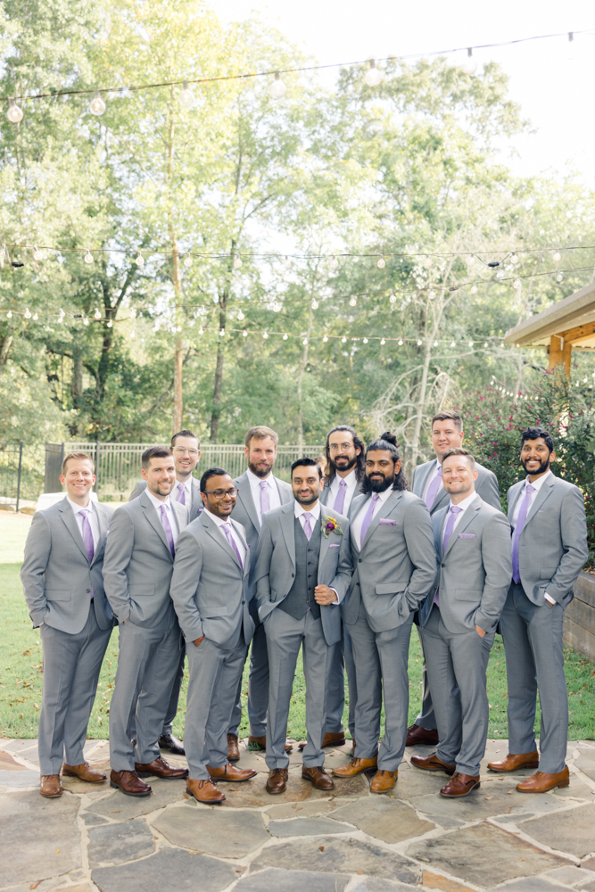 The groom stands with his groomsmen for a Southern wedding at Mathews Manor in Springville, Alabama.