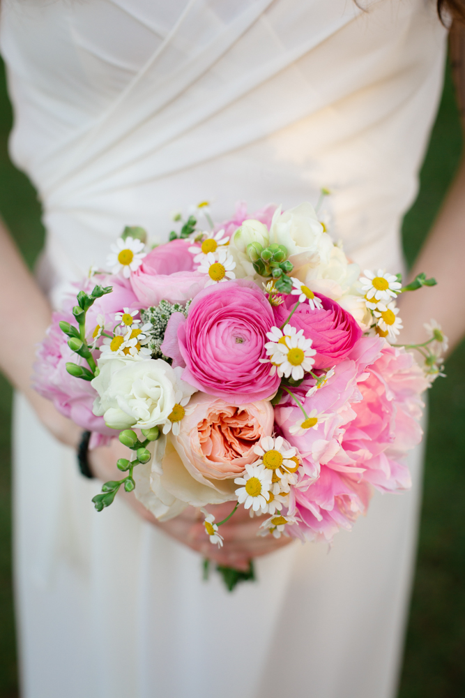 The bridesmaid holds a bouquet of pink flowers for this Alabama wedding ceremony.