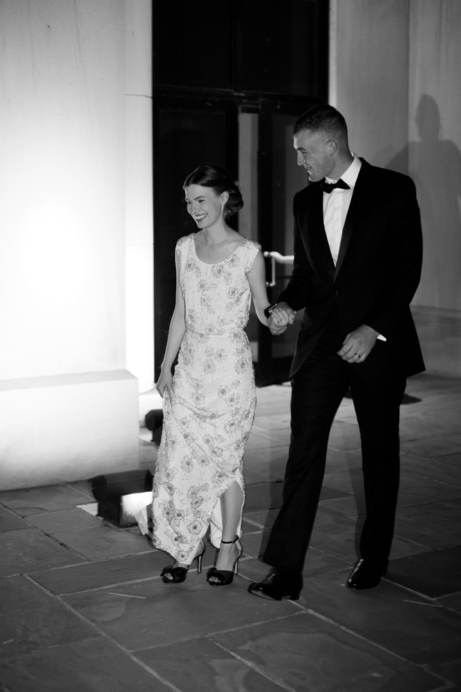 The bride and groom join the reception on the patio of the Montgomery Museum of Fine Arts.