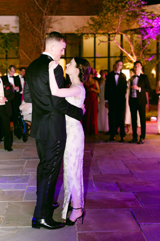 The bride and groom share a first dance on the patio of Montgomery Museum of Fine Arts.