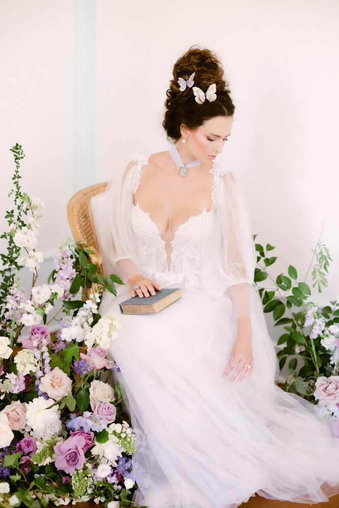 The bride sits in her wedding dress from Imperial Formal Wear in Birmingham, Alabama.