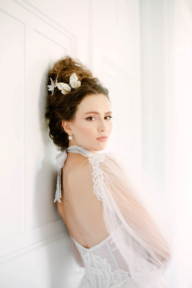 The bride wears a dress with sheer sleeves and bodice at The 1616 House in Montgomery, Alabama.