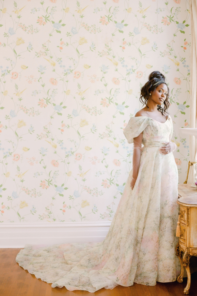 The Southern bride wears a colorful floral dress from Ivory & White Bridal Boutique.