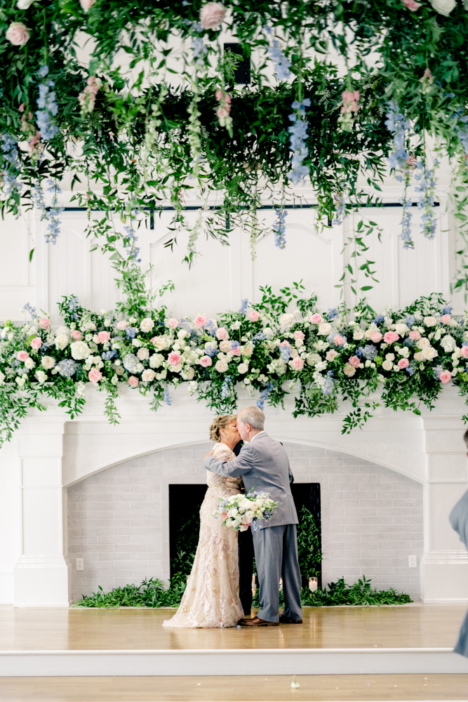 The couple shares a kiss at their Southern vow renewal ceremony at Oak Meadow Event Center.