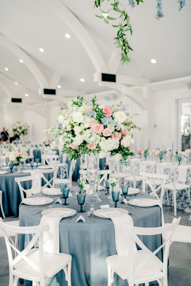 Oak Meadow Event Center is decorated with blue, pink, and white tablescapes for this Southern vow renewal celebration.