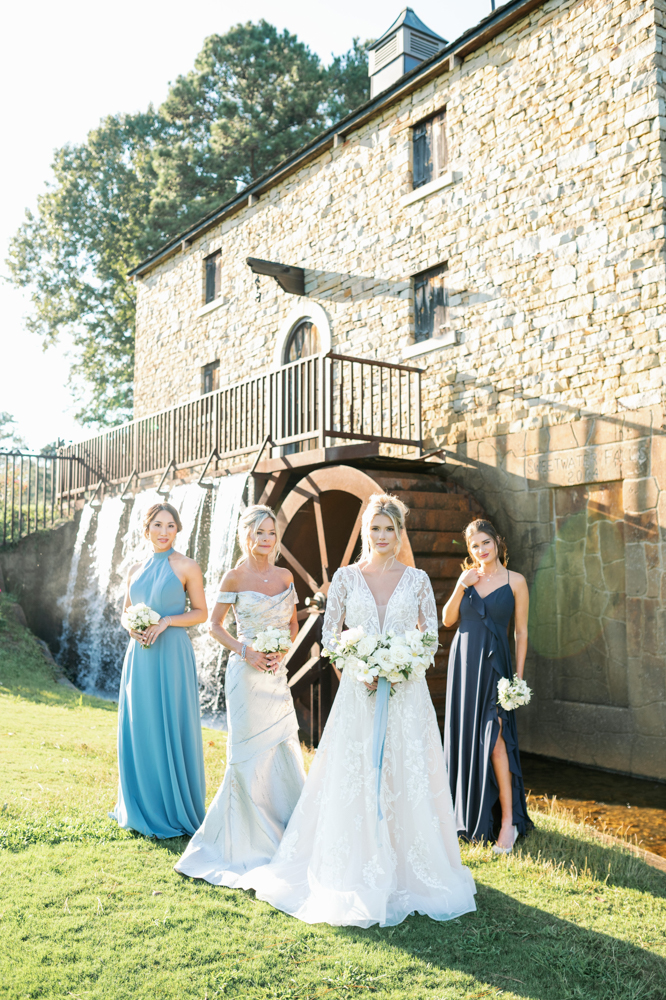 The bridal party poses together during a sunset at Ross Bridge Golf Resort & Spa.