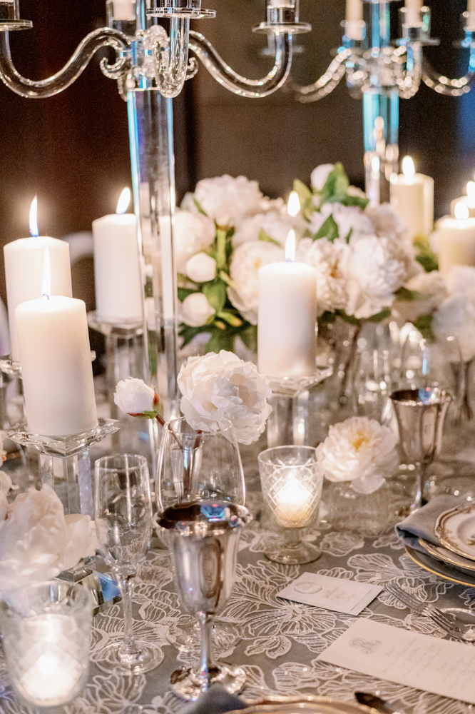 Candlelight and peonies are the stars of this winter wedding tablescape designed by Anna Wynn Event Designs.