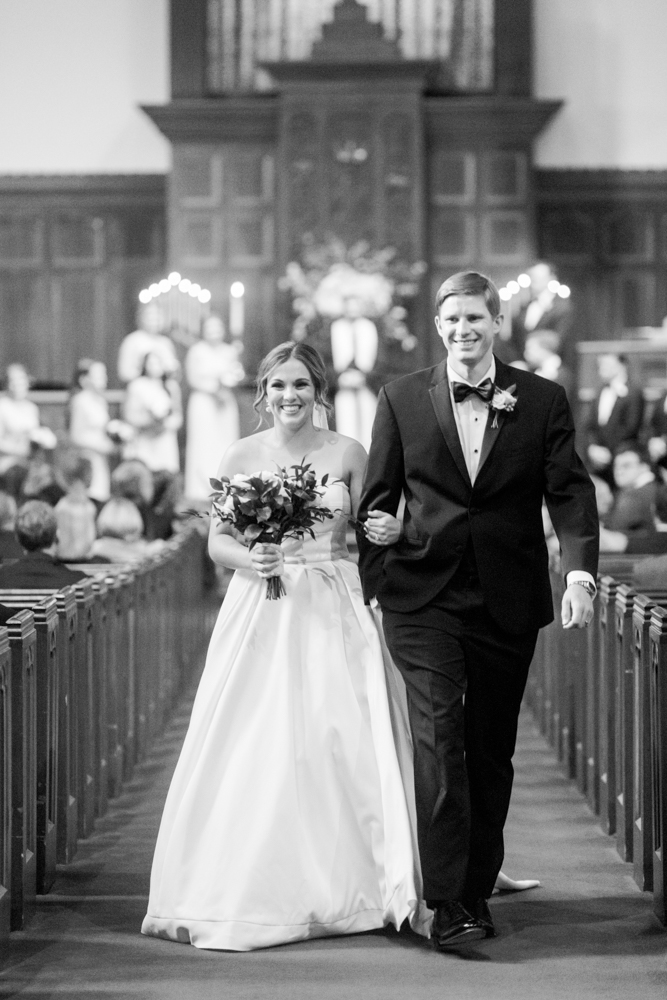 Katherine Grey Clarke & Everett Michael Fuller exit their wedding ceremony.