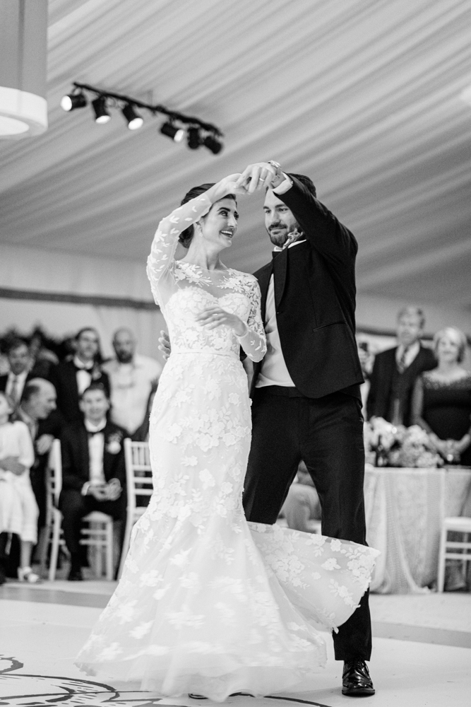 The grooms spins the bride in their first dance during this South Alabama wedding.