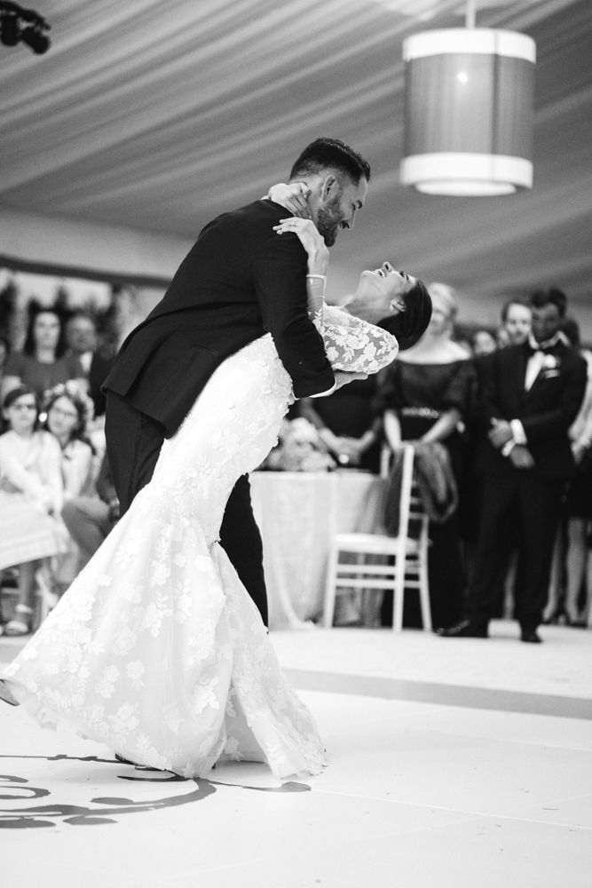 The grooms dips the bride during a first dance for their Southern wedding.