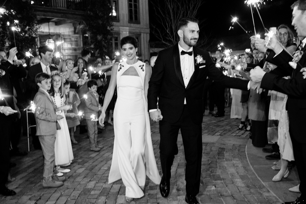 The bride and groom exit the wedding reception in Fairhope, Alabama.