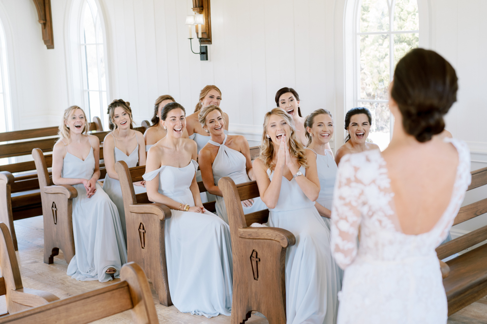 The bridal party sees the bride for the first time before the wedding ceremony.