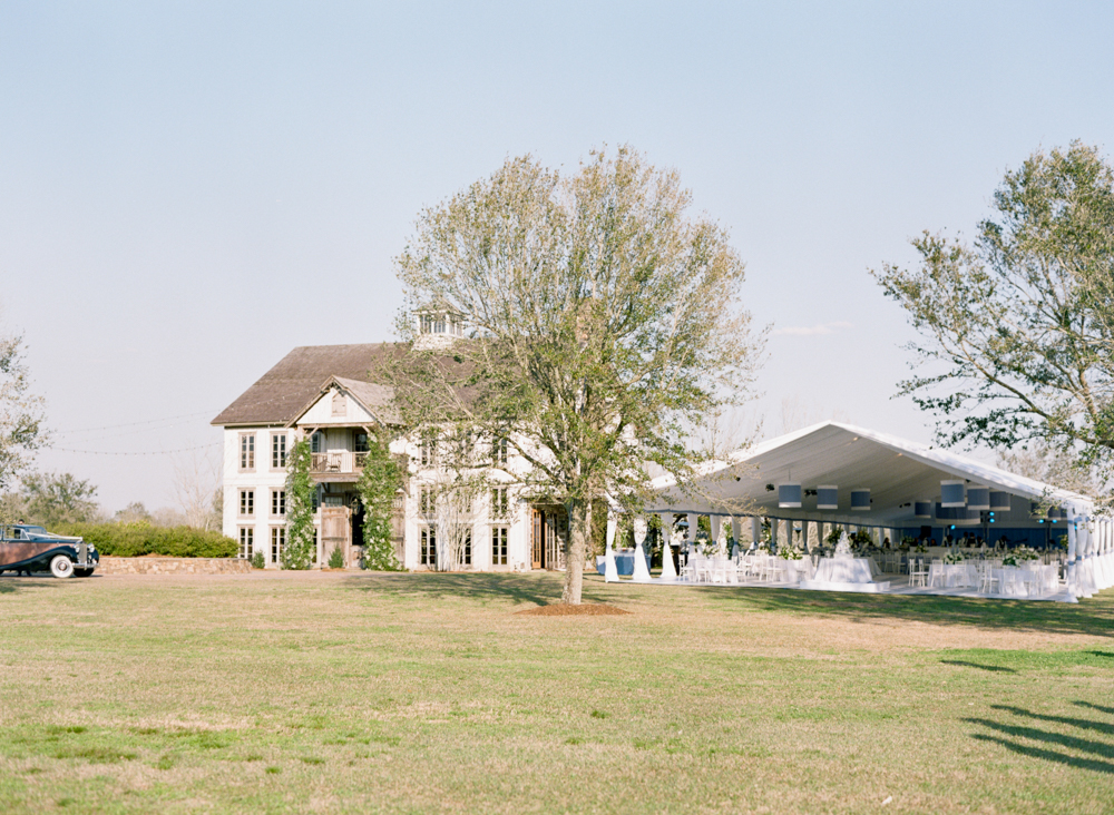 The tent reception is set next to the family home for this Southern wedding in Fairhope.