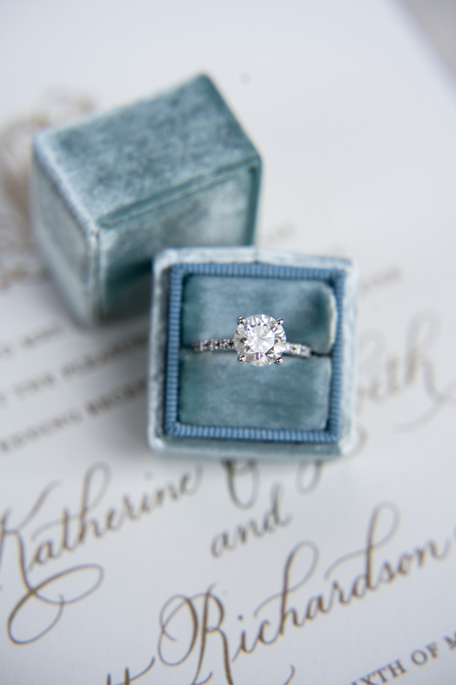 The engagement ring is photographed by Alisha Crossley Photography with her wedding stationery.