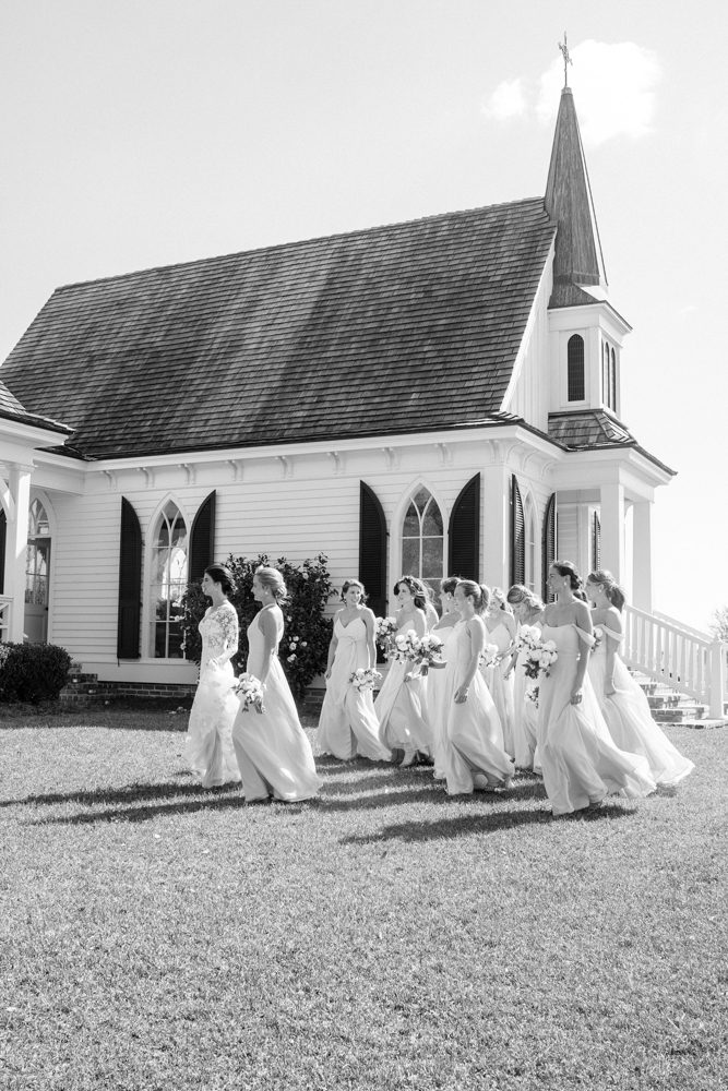 The bridal party walks together in front of a South Alabama chapel before the wedding.