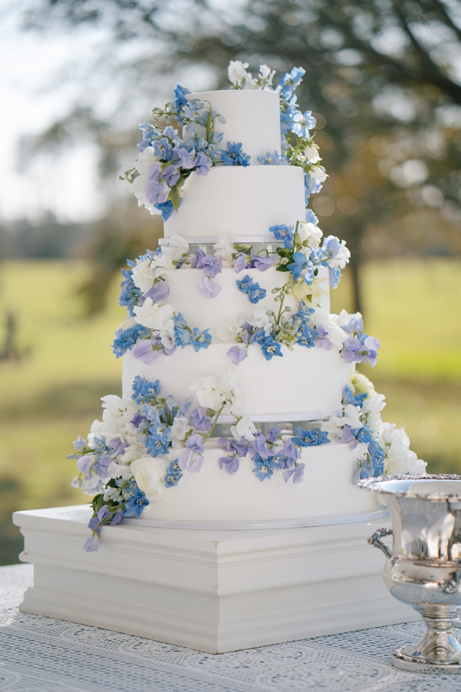 A blue and lavender wedding cake is set for this Southern wedding in Fairhope, Alabama.