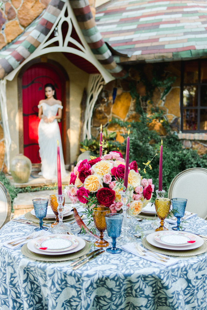 The tablescape by Jubilee Flowers is set in front of the Fairhope Storybook Castles.