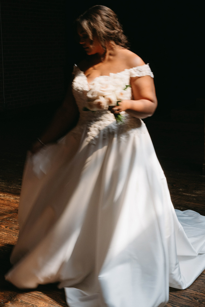 The bride wears a beautiful dress at B&A Warehouse in Birmingham, Alabama.