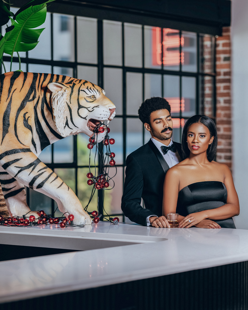 Southern wedding guests stand by the bar at The Fennec in Birmingham.