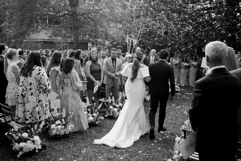 The father of the bride walks his daughter down the aisle of this intimate Huntsville wedding.