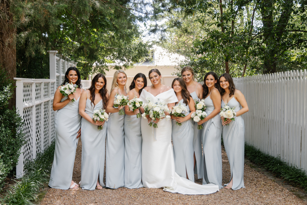 The bride stands with her bridesmaids before the Huntsville wedding ceremony in Alabama.