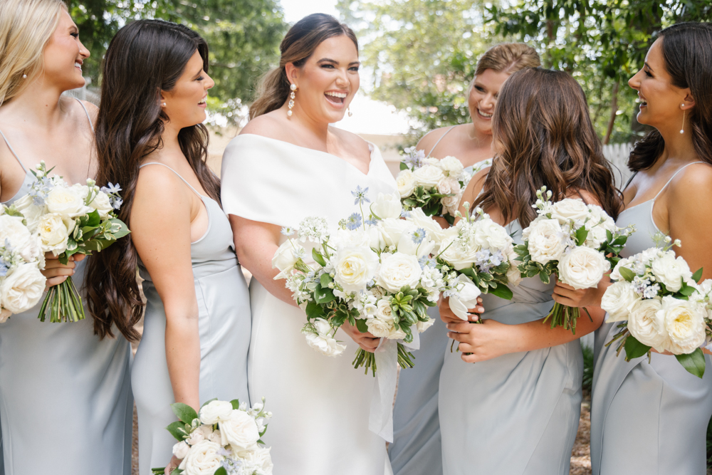 The bride smiles with her bridesmaids before the wedding ceremony in Huntsville, Alabama.