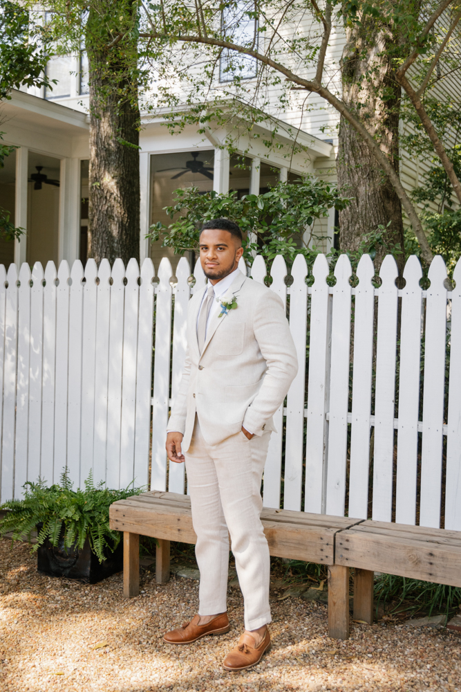 The groom wears a Billy Reid suit before his Southern wedding in Huntsville.