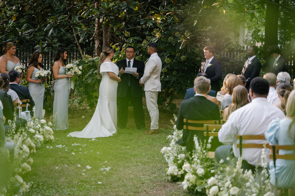 The couple shares their vows in the backyard of this intimate Huntsville wedding.