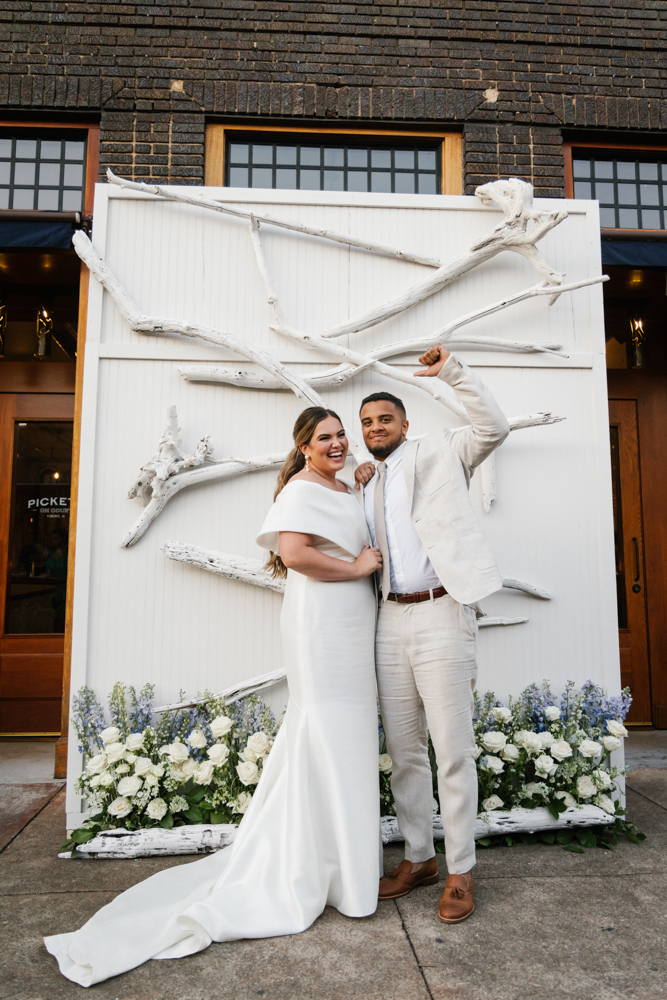 The bride and groom pose together before their Huntsville wedding.